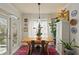 Bright dining area with a rustic wood table, ample natural light, and stylish decor at 3777 Peachtree Ne Rd # 1227, Brookhaven, GA 30319