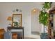 Inviting entryway features a mirror, table, decor and arched doorway leading into the home at 3777 Peachtree Ne Rd # 1227, Brookhaven, GA 30319