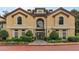 Elegant building exterior featuring arched windows, lush landscaping, and a grand entrance at 3777 Peachtree Ne Rd # 1227, Brookhaven, GA 30319