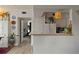 View showcasing the pass-through to the kitchen with counter seating and natural light from the bedroom entrance at 3777 Peachtree Ne Rd # 1227, Brookhaven, GA 30319