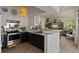 Updated kitchen with stainless steel appliances, modern cabinets and a view to the living room at 3777 Peachtree Ne Rd # 1227, Brookhaven, GA 30319