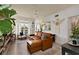 Inviting living room featuring a leather sofa, ceiling fan, and a serene ambiance at 3777 Peachtree Ne Rd # 1227, Brookhaven, GA 30319