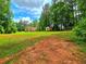 View of the expansive backyard and home, showcasing the outdoor space, landscaping and storage shed at 4086 Rex Road, Rex, GA 30273