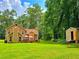 Expansive backyard with a patio area, featuring a grill and ample space for entertaining guests at 4086 Rex Road, Rex, GA 30273