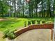 Expansive backyard with manicured lawn, mature trees, and a patio area for entertaining at 4086 Rex Road, Rex, GA 30273