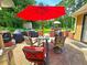 Patio with umbrella, outdoor furniture, grilling, and wooded view at 4086 Rex Road, Rex, GA 30273