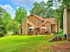 Backyard featuring a brick patio area, perfect for outdoor dining, and a well-maintained lawn at 4086 Rex Road, Rex, GA 30273