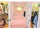 A primary bath features a tub with and walk-in closets at 4086 Rex Road, Rex, GA 30273