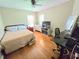 Guest bedroom offers hardwood floors, good natural light, and closet space at 4086 Rex Road, Rex, GA 30273