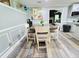 Cozy dining area adjacent to kitchen and living room features modern lighting and stylish décor at 4086 Rex Road, Rex, GA 30273