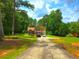 Charming two-story home with black shutters, brick chimney, and a well-kept front lawn at 4086 Rex Road, Rex, GA 30273