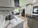 Kitchen features granite counters, stainless steel appliances, and ample storage at 4086 Rex Road, Rex, GA 30273