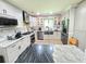 Kitchen features granite counters, stainless steel appliances, and ample storage at 4086 Rex Road, Rex, GA 30273