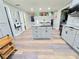 Kitchen island boasts granite countertops and ample storage space, offering an open view of the connected dining area at 4086 Rex Road, Rex, GA 30273