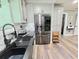 Spacious kitchen featuring stainless steel appliances and a modern design with ample counter space at 4086 Rex Road, Rex, GA 30273
