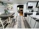 Open floor plan kitchen and dining area featuring granite countertops, stainless steel appliances, and ample natural light at 4086 Rex Road, Rex, GA 30273