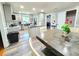 Bright eat-in kitchen with granite counters, ample cabinet storage, and stainless steel appliances at 4086 Rex Road, Rex, GA 30273