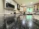 Kitchen features granite counters, stainless steel appliances, and a large center island at 4086 Rex Road, Rex, GA 30273