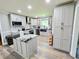 Modern kitchen features granite counters, center island, stainless steel appliances, and ample storage at 4086 Rex Road, Rex, GA 30273