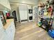 Laundry room featuring modern wood-look flooring, storage and washer/dryer at 4086 Rex Road, Rex, GA 30273