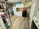 Laundry room featuring modern wood-look flooring, washer/dryer and storage at 4086 Rex Road, Rex, GA 30273
