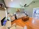 Bright living room featuring hardwood floors, neutral decor, and a vaulted ceiling at 4086 Rex Road, Rex, GA 30273