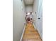 Stairway landing looking into a living room with a fireplace at 4086 Rex Road, Rex, GA 30273