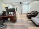 Spacious living room featuring modern wood-look flooring and ample natural light at 4086 Rex Road, Rex, GA 30273