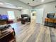 Spacious living room featuring modern wood-look flooring and ample natural light at 4086 Rex Road, Rex, GA 30273