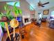 Bright living room with hardwood floors, a fireplace, a ceiling fan, and plenty of seating at 4086 Rex Road, Rex, GA 30273