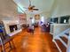 Spacious living room boasts a fireplace, high ceilings, hardwood floors, and plenty of natural light at 4086 Rex Road, Rex, GA 30273