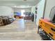 Spacious living room featuring modern wood-look flooring and ample natural light at 4086 Rex Road, Rex, GA 30273