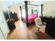 This main bedroom boasts a four poster bed, hardwood flooring, and great natural light at 4086 Rex Road, Rex, GA 30273