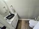 Chic powder room featuring a sleek vanity, black sink, granite countertop, and stylish fixtures at 4086 Rex Road, Rex, GA 30273