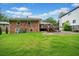 Expansive backyard with a brick home and a deck at 1315 Merry Ne Ln, Atlanta, GA 30329