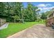 Lush backyard featuring a swing set and plenty of green space at 1315 Merry Ne Ln, Atlanta, GA 30329