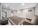Finished basement with tile floors, a lounge chair, and ample lighting creates a cozy and inviting space at 1315 Merry Ne Ln, Atlanta, GA 30329