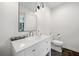 Updated half bath with granite countertop and modern fixtures at 1315 Merry Ne Ln, Atlanta, GA 30329