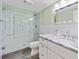 Bright bathroom featuring a glass-enclosed shower and vanity with a marble countertop at 1315 Merry Ne Ln, Atlanta, GA 30329