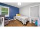 Cozy bedroom with hardwood floors, a comfortable bed, and ample natural light creates a serene retreat at 1315 Merry Ne Ln, Atlanta, GA 30329