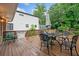 Charming wooden deck with comfortable seating arrangements and umbrella at 1315 Merry Ne Ln, Atlanta, GA 30329