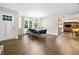 Open concept dining room featuring hardwood floors, modern chandelier, and views to the living area at 1315 Merry Ne Ln, Atlanta, GA 30329