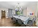 Dining room with modern lighting and views to the kitchen at 1315 Merry Ne Ln, Atlanta, GA 30329