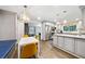 Open-concept kitchen and dining area with gray cabinets, stainless steel appliances, and hardwood floors at 1315 Merry Ne Ln, Atlanta, GA 30329