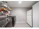 Clean laundry room with modern washer, dryer, and refrigerator at 1315 Merry Ne Ln, Atlanta, GA 30329