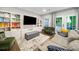 Comfortable living room with custom built-ins, hardwood floors, and French doors to the outside at 1315 Merry Ne Ln, Atlanta, GA 30329