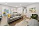 Open concept living room with hardwood floors, neutral colors, and view to the dining area at 1315 Merry Ne Ln, Atlanta, GA 30329