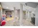 Spacious playroom with tiled flooring and decorative support columns at 1315 Merry Ne Ln, Atlanta, GA 30329