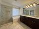 Luxurious bathroom with a glass-enclosed shower, soaking tub, and double vanity at 1417 Wind Chime Ct, Lawrenceville, GA 30045
