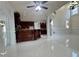 Open-concept living area with tile floors and custom bar at 1417 Wind Chime Ct, Lawrenceville, GA 30045